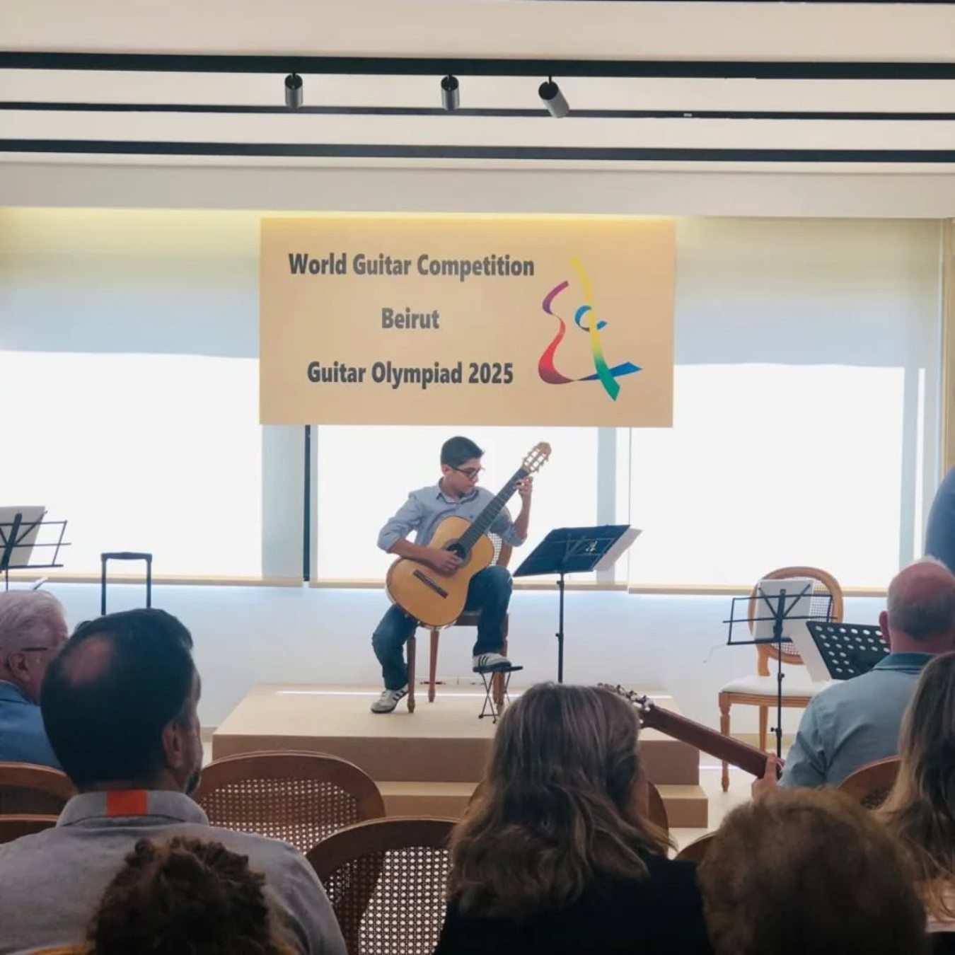 A student performing at the World Guitar Competition, Guitar Olympiad 2025 in Beirut